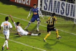 AFP-Uruguay's Penarol Diego Alonso (R) attempts a goal, that was later disallowed by the referee