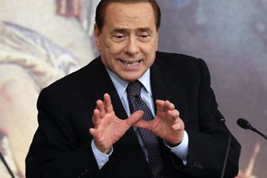 r_Italian Prime Minister Silvio Berlusconi leads a news conference at Chigi palace in Rome June 30, 2011. Italy's cabinet on Thursday approved an austerity package aimed at shielding the country from the Greek debt crisis and eliminating the budget deficit in 2014