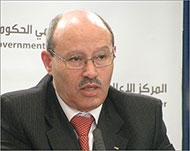وزير الاقتصاد حسن أبو لبدة متهم بغسل الأموال (الجزيرة)