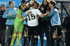 Uruguayan midfielder Diego Perez (C) celebrates with teammates after scoring against Argentina during their 2011 Copa America quarter-final football match held at the Cementerio de Elefantes stadium in Santa Fe, 476 Km north of Buenos Aires, on July 16, 2011.