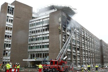 f_Firefigthers work at the site of an explosion near government buildings in Norway's capital Oslo on July 22, 2011. A powerful bomb blast rocked government and media buildings in Norway's capital Oslo on Friday, causing "deaths and injuries