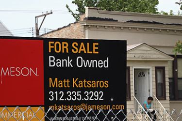 CHICAGO, IL - MAY 31: A 'For Sale' sign stands in front of a vacant lot May 31, 2011 in Chicago, Illinois. According to the Standard & Poor's Case-Shiller Home Price Index home prices fell in March in 18