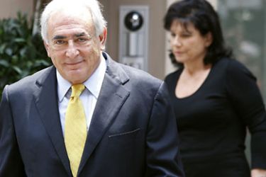 r_Former International Monetary Fund (IMF) chief Dominique Strauss-Kahn and his wife Anne Sinclair leave their temporary Manhattan residence in New York July 6, 2011