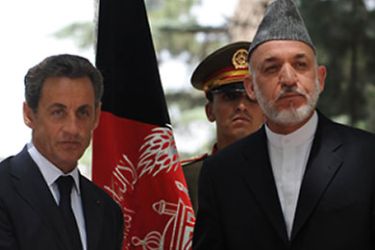 Afghan President Hamid Karzai (R) shakes hands with his French counterpart Nicolas Sarkozy following a joint press conference at the Presidential Palace in Kabul on July 12, 2011. Sarkozy arrived in Afghanistan on July 12 for a surprise visit to meet troops serving with NATO's coalition force, an AFP reporter said. AFP