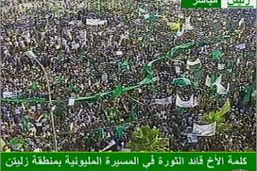 An image grab taken from Libyan state TV shows Libyan regime supporters rallying in Zilten, 150 kilometres (90 miles) east of Tripoli, on July 15, 2011 as a message by Libyan leader Moamer Kadhafi was relayed