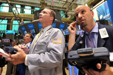 Traders work the floor of the New York Stock Exchange at the opening bell August 9, 2011. US stocks surged more than one percent on opening Tuesday following Monday's plunge, but within minutes the gains fell off on profit-taking. The Dow Jones Industrial Average added 9.99 points (0.09 percent) to 10,819.84 in the first 15 minutes of trade.