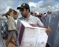   الكعبي يشارك في توزيع المساعدات