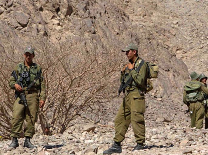 Israeli soldiers are seen near the Israeli-Egyptian border August 19, 2011, the day after a series of deadly attacks along Israel's porous border with Egypt. Eight Israelis died and 25 were injured in Thursday's assaults on a normally tranquil desert road. Israeli leaders accused Egypt's new rulers of losing their grip in the Sinai region, stoking tensions between the two neighbours.