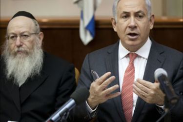 Israeli Prime Minister Benjamin Netanyahu addresses the weekly cabinet meeting in Jerusalem on August 28, 2011. AFP PHOTO/POOL/URIEL SINAI