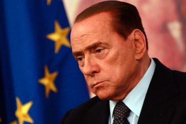 Italy's Prime Minister Silvio Berlusconi attends a news conference at Chigi Palace in Rome August 5, 2011. Berlusconi pledged on Friday to bring forward austerity measures and bring Italy's budget into balance by 2013, a year ahead of the original plan, in a bid to stem rising turmoil on world markets.