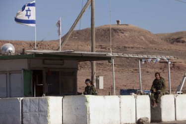 Israeli female soldiers man an army checkpoint at the borderpoint between Israel and Egypt, north of the Red Sea town of Eilat on August 19, 2011, one day after a series of deadly attacks near the Israeli resort in which eight Israelis were killed in an operation the Jewish state blamed on the Gaza-based Popular Resistance Committees (PRC).