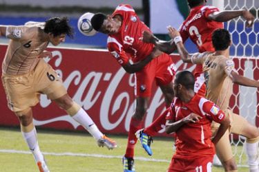 Egypt's player Ahmed Hegazi (L) heads the ball to score against Panama during their FIFA World Cup U20 Group E football match held at the Metropolitano stadium in Barranquilla, Colombia, on August 1, 2011.