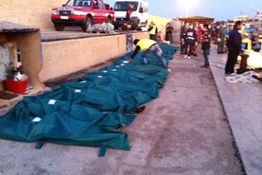 epa02851512 A row of dead bodies recovered from a ship that arrived from Libya at a harbour in Lampedusa, Italy, 01 August 2011.