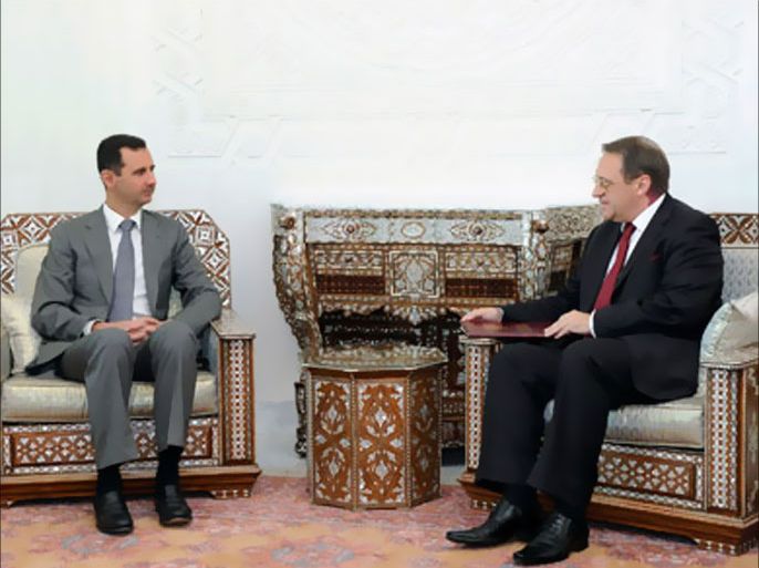 Syria's President Bashar al-Assad (L) meets Russian Deputy Foreign Minister Mikhail Bogdanov in Damascus August 29, 2011, in this handout photograph released by Syria's national news agency SANA.