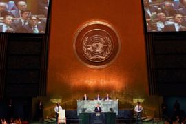 Iran's Foreign Minister Manouchehr Mottakias (on video screen at top) listens as U.S. President Barack Obama addresses the 66th United Nations General Assembly at U.N. headquarters in New York, September 21, 2011.