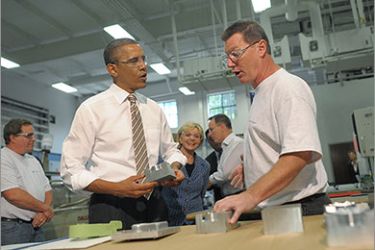 US President Barack Obama chats with an employee as he tours WestStar Precision with North Carolina Governor Bev Perdue (C rear) on September 14, 2011 in Apex, North Carolina. Obama was in North Carolina to visit a yhe manufacturing facility and the North Carolina State University to speak on his proposed American Jobs Act. AFP PHOTO/Mandel NGAN