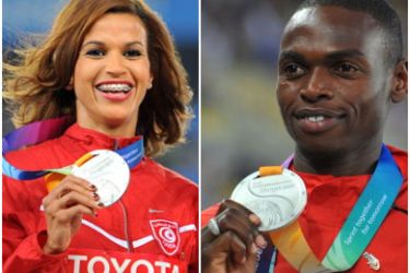 (right) Silver medallist Abubaker Kaki of Sudan smiles during the awards ceremony for the men's 800 metres . and (left) Silver medallist Habiba Ghribi of Tunisia poses on the podium during the awards ceremony for the women's 3000 metre steeplechase event at the International Association of Athletics Federations (IAAF) World Championships in Daegu on September 1, 2011