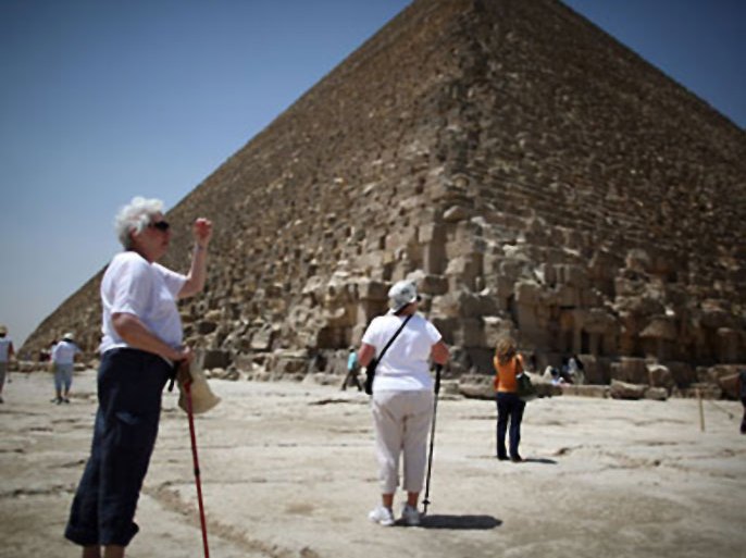 CAIRO, EGYPT - MAY 28: American tourists visit the Great Pyramid of Cheops on May 28, 2011 in Giza, Egypt. Protests in January and February brought an end to 30 years of autocratic rule by President Hosni Mubarak who will now face trial. Food prices have doubled and youth unemployment stands at 30%. Tourism is yet to return to pre-uprising levels. (Photo by Peter Macdiarmid/Getty Images)