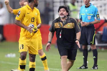 afp-Argentine football legend Diego Maradona and coach of UAE's Al-Wasl club reacts during his team's Emirates Cup