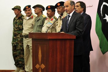 r_Libyan National Transitional Council (NTC) Chairman Mustafa Abdel Jalil (R) attends a news conference with leaders of the National Army in Benghazi October 24, 2011