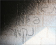 شعارات انتقامية كتبها الجناة على جدران المسجد