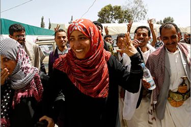 Yemeni winner of the Nobel Peace Prize Tawakul Karman is congratulated by her supporters after winning the Nobel Prize outside her tent in Tagheer Square in Sanaa October 7, 2011. Karman said on Friday the award was a victory for Yemen's democracy activists and they would not give up until they had won full rights in a "democratic, modern Yemen". REUTERS/Ahmed Jadallah (YEMEN - Tags: POLITICS SOCIETY PROFILE)