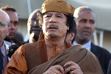 epa02973591 (FILE) A file picture dated 10 April 2011 shows former Libyan leader Muammar Gaddafi standing outside his tent in the heavily fortified military barracks and compound of Bab Al Azizia after meeting with a delegation of five African leaders seeking to mediate in Libya's conflict in Tripoli, Libya. According to media reports on 20 October 2011, Gaddafi was captured close Sirte, Libya. EPA/MOHAMED MESSARA