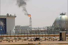 A gas flame is seen in the desert near the Khurais oilfield, about 160 km (99 miles) from Riyadh, in this June 23, 2008 file photo. The world may have to live on a much lesser Saudi Arabian crude oil towards the end of this decade as rampant internal demand eats into oil exports and the kingdom's alternative energy plans may prove too little too late. To match Analysis SAUDI-OIL/EXPORTS REUTERS/Ali Jarekji/Files (SAUDI ARABIA - Tags: ENERGY BUSINESS)