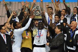 Qatar's Al Sadd players celebrate with the trophy after winning the AFC Champions League football final against South Korea's Jeonbuk Hyundai Motors in Jeonju, some 200