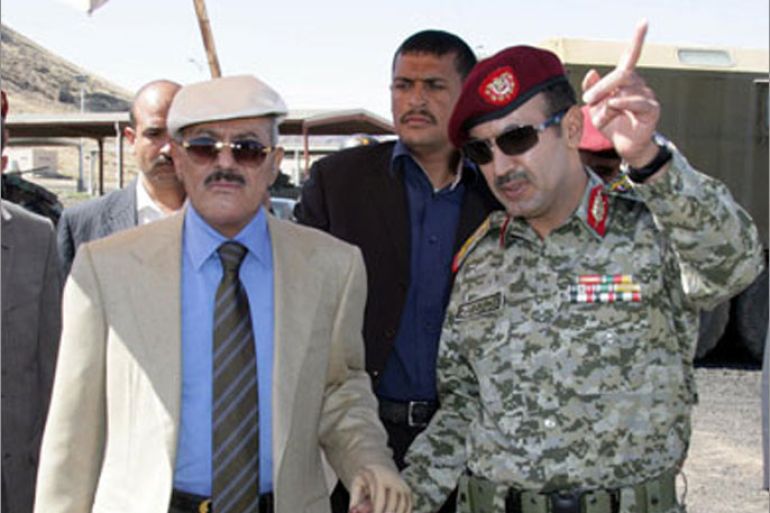 epa03008955 A handout picture released by the Yemeni Presidency Office shows Yemeni President Ali Abdullah Saleh (L) listens to his eldest son Colonel Ahmed Ali Abdullah Saleh (R), Commander of the Republican Guards at a military site in Sana?a, Yemen, 19 November 2011.