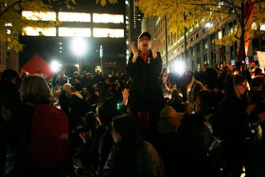 NEW YORK, NY - NOVEMBER 15: Protesters celebrate after re-entering Zuccotti Park on November 15, 2011 in New York City. Police had removed the protesters from the park early in the morning. A judge ruled that protesters are allowed back to the park but won't be allowed to camp there.
