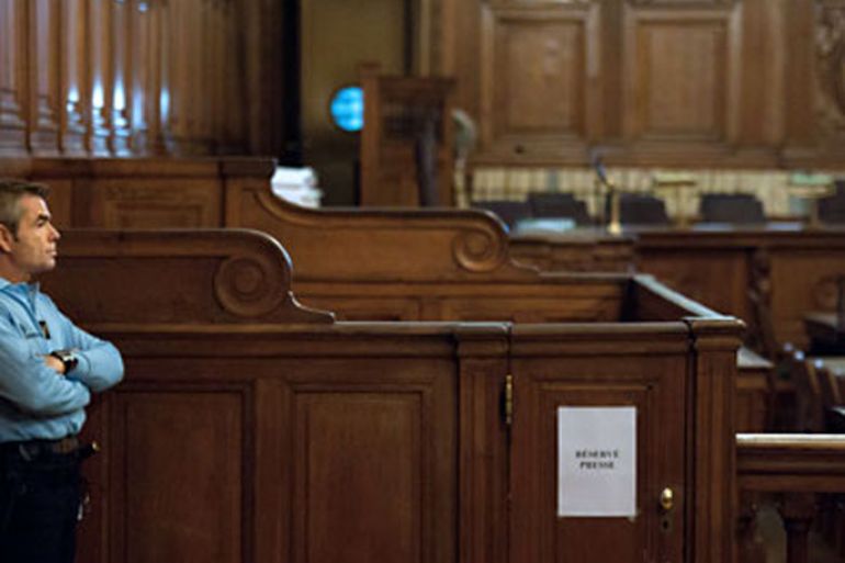 A policeman stands on November 7, 2011 in the courtroom of Paris' special court where Venezuelan militant Ilich Ramirez Sanchez aka Carlos goes on trial today charged with four deadly bombings carried out almost 30 years ago. These attacks in 1982 and 1983 billed as part of a private war Carlos waged against France to free two comrades, including his future wife