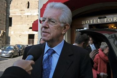 Former EU commissioner Mario Monti speaks to the press as he leaves his hotel on November 13, 2011 in Rome. Italy readied a new government on Sunday after the momentous resignation of Prime Minister Silvio Berlusconi, with former European Union commissioner Mario Monti tipped to take over amid a debt crisis.