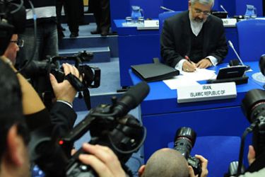 The Iranian ambassador to the (IAEA) Ali Asghar Soltanieh (R) reviews documents before the opening of the board of governors conference at the agency headquarters in Vienna on November 18, 2011. The UN atomic watchdog's board was expected to pass a resolution of "deep and increasing concern" about Iran's nuclear activities after a damning new report from the Vienna-based body.