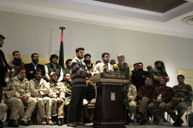 Leader of Libya Rebels of Tripoli Abdullah Naker speaks during a press conference sarrounded by members of Libya's Rebels Union at a hotel in Tripoli on November 17, 2011