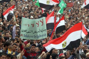 Tens of thousands of Egyptian protesters wave national flags during a rally held in Cairo's landmark Tahrir Square on November 18, 2011 with the aim of pushing Egypt's ruling military to cede power, 10 months after an uprising that toppled Hosni Mubarak's regime.