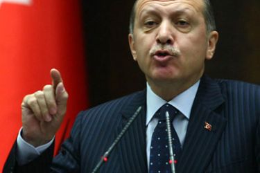 Turkey's Prime Minister Recep Tayyip Erdogan addresses lawmakers in Ankara on November 22, 2011.