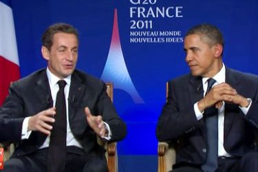 A TV grab made from French TV channel France 2 on November 4, 2011 shows US president Barack Obama (R) listening to his French counterpart Nicolas Sarkozy during their joint appearance for a pre-recorded interview at the end of the G20 meeting of Cannes.