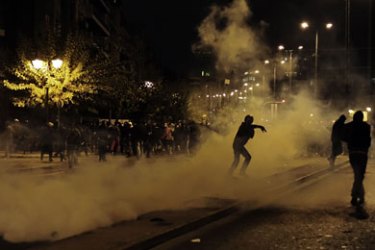 Demonstrators clash with riot police in Athens on November 17, 2011. Tens of thousands of Greeks took to the streets today to protest against austerity measures demanded by the new unity government, clashing briefly with police who responded with tear gas.