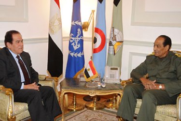 A handout picture released by the Egyptian military press office shows Egypt's former premier Kamal al-Ganzuri (L) during a meeting with Field Marshal Mohammed Hussein Tantawi, head of Egypt's ruling military council, in Cairo on November 24, 2011.