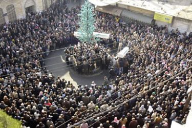 Anti-government protesters carry coffins during the funeral of protesters killed in earlier clashes in Damascus suburb of Zabadani December 21, 2011