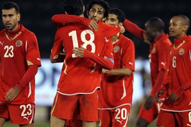 ف- Bahrain's Fahad al-Hardan (18) celebrates with his teammates after scoring a goal against Iraq