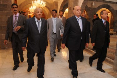 Yemeni Vice President Abdrabuh Mansur Hadi (2nd R) and Prime Minister Mohammed Basindawa (2nd L) arrive at a swearing-in ceremony of Yemen's national unity government at the Republican Palace in the capital Sanaa on December 10, 2011. The 34-member cabinet, led by the opposition, is divided equally among President Ali Abdullah Saleh loyalists from the ruling General People's Congress (GPC) and the formal opposition Common Forum.