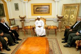 afp : Sudanese President Omar al-Bashir (C) meets with exiled Hamas supremo Khaled Meshaal (L), Hamas prime minister Ismail Haniya (2nd R) and deputy Hamas leader Mussa Abu Marzuq (R) at the presidential palace in Khartoum on December 29, 2011. Haniya is on his first regional tour since the Islamist movement took over the Gaza Strip in 2007. AFP PHOTO/ASHRAF SHAZLY