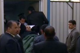 A still image taken from a video boradcast on Egypt's Nile television channel shows ousted president Hosni Mubarak being wheeled on a hospital stretcher into court for the resumption of his trial in Cairo on December 28, 2011, after a three-month hiatus.