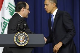r_U.S. President Barack Obama (R) and Iraq's Prime Minister Nuri al-Maliki (L) shake hands after a joint news conference in the Eisenhower Executive Office Building on the White