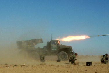 A handout picture released by the official Syrian Arab News Agency (SANA) shows Syrian military performing live ammunition exercises in an undisclosed location on December 4, 2011
