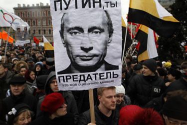 Opposition supporters hold a rally to protest against violations at the parliamentary elections and the policies conducted by current Russian authorities in St. Petersburg