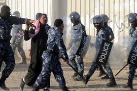 Kuwaiti riot police detain a stateless Arab, known as bidoon, during a protest to demand citizenship and other basic rights in Jahra, 50 kms (31 miles) northwest of Kuwait City, on December 19, 2011. AFP