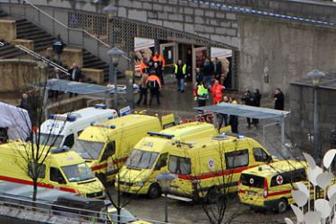 General view shows medical team with ambulances and police on the Saint-Lambert square in Liege after a man threw multiple grenades on December 13, 2011. Two